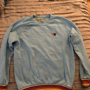 Aviator Nation Light Blue Crewneck Sweater with Rainbow Accents